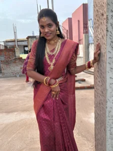 Traditional South Indian bridal makeup with flawless skin and elegant hairstyle